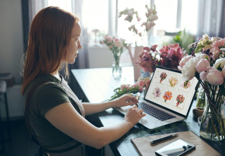 Young woman viewing flower website